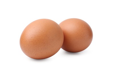 Photo of Two raw chicken eggs isolated on white