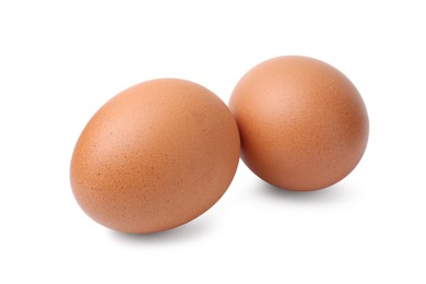Photo of Two raw chicken eggs isolated on white
