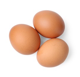 Photo of Raw chicken eggs isolated on white, top view