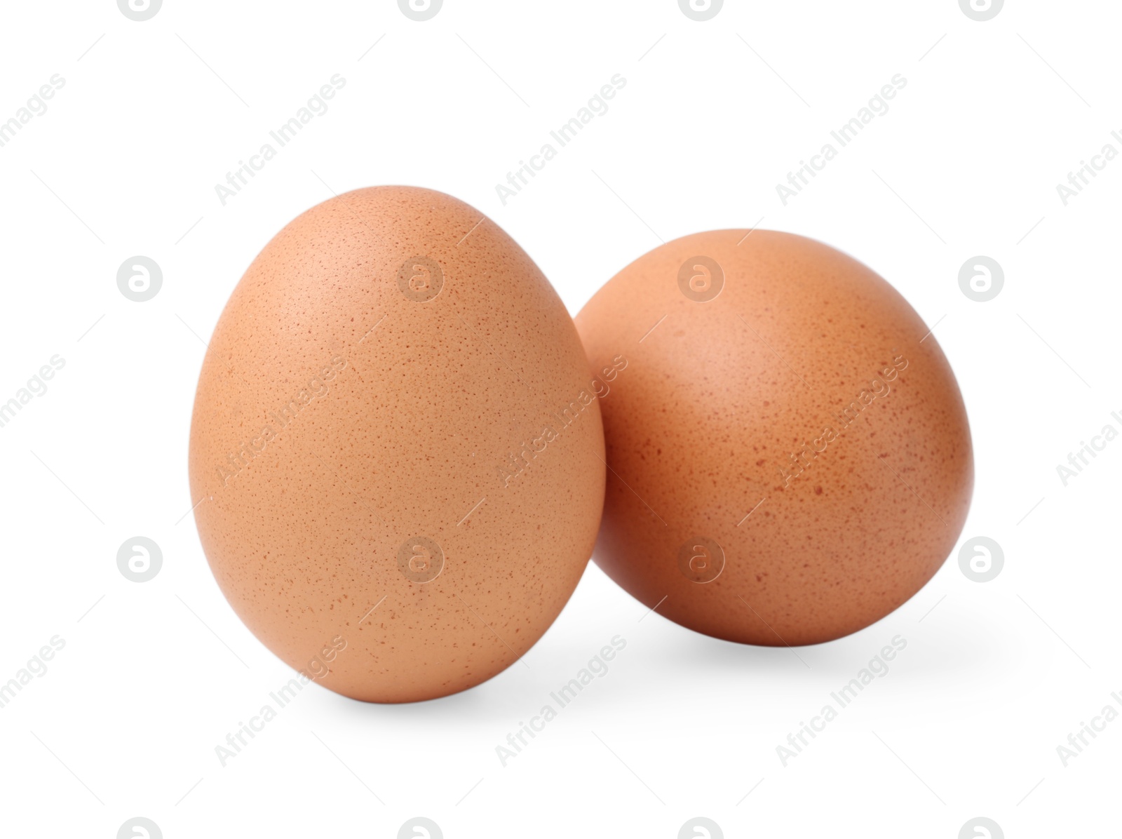 Photo of Two raw chicken eggs isolated on white