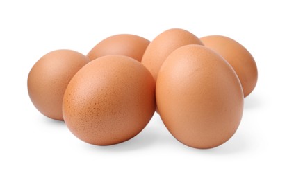 Photo of Many raw chicken eggs isolated on white