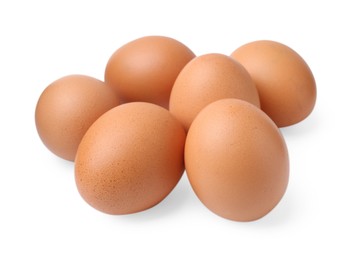 Photo of Many raw chicken eggs isolated on white