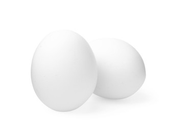 Photo of Two raw chicken eggs isolated on white
