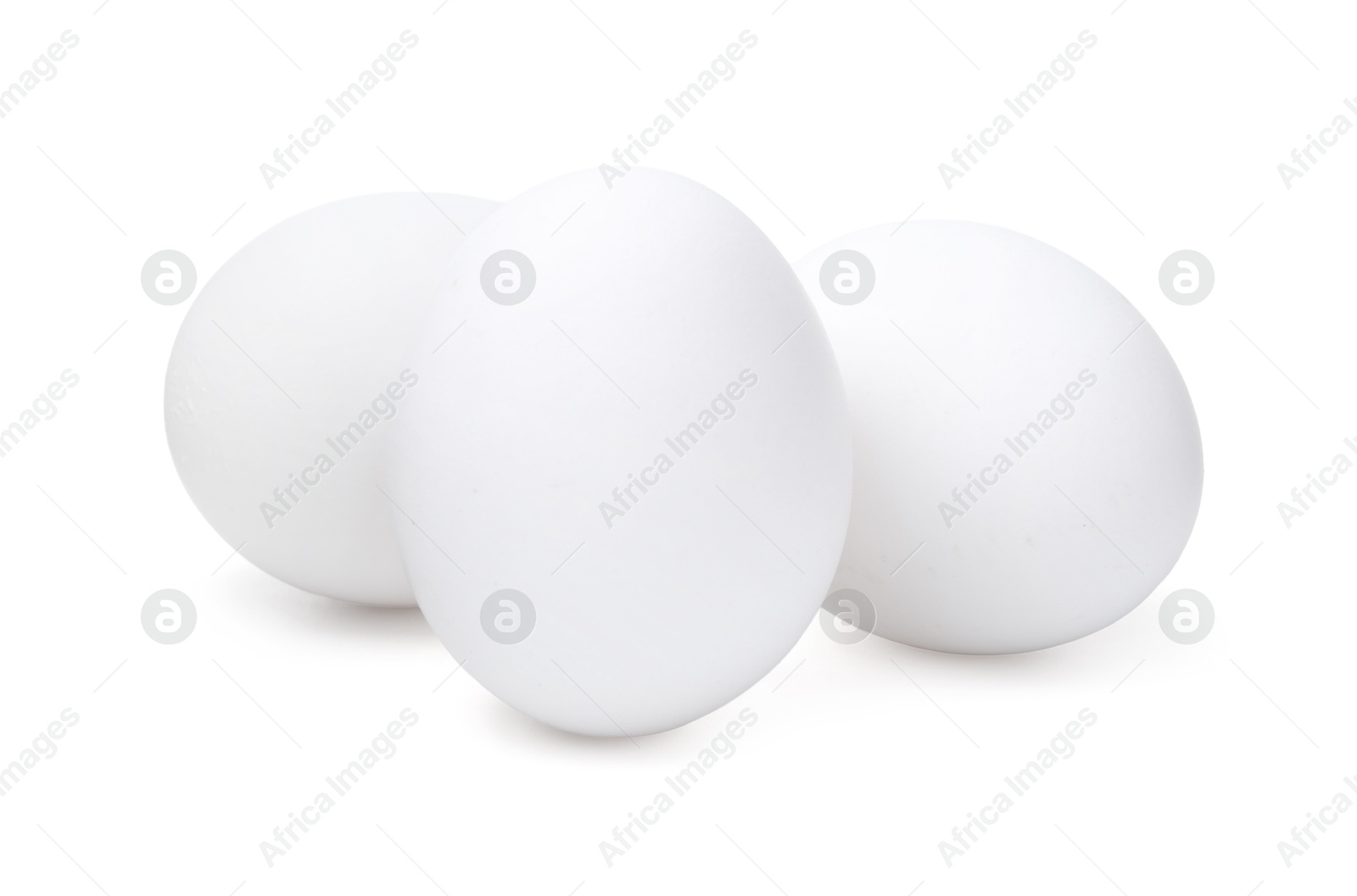 Three raw chicken eggs isolated on white Photo of Three raw chicken eggs isolated on white