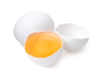 Photo of Whole and broken chicken eggs isolated on white