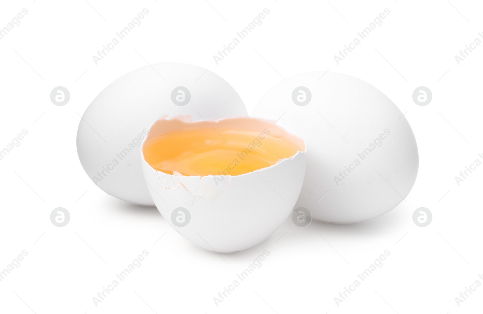 Whole and broken chicken eggs isolated on white Photo of Whole and broken chicken eggs isolated on white