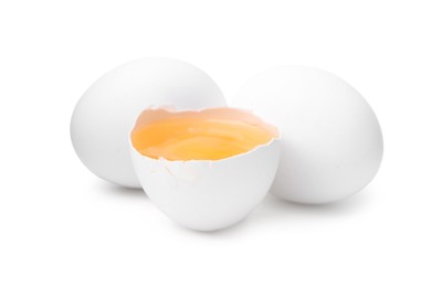 Photo of Whole and broken chicken eggs isolated on white