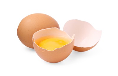 Photo of Whole and broken chicken eggs isolated on white