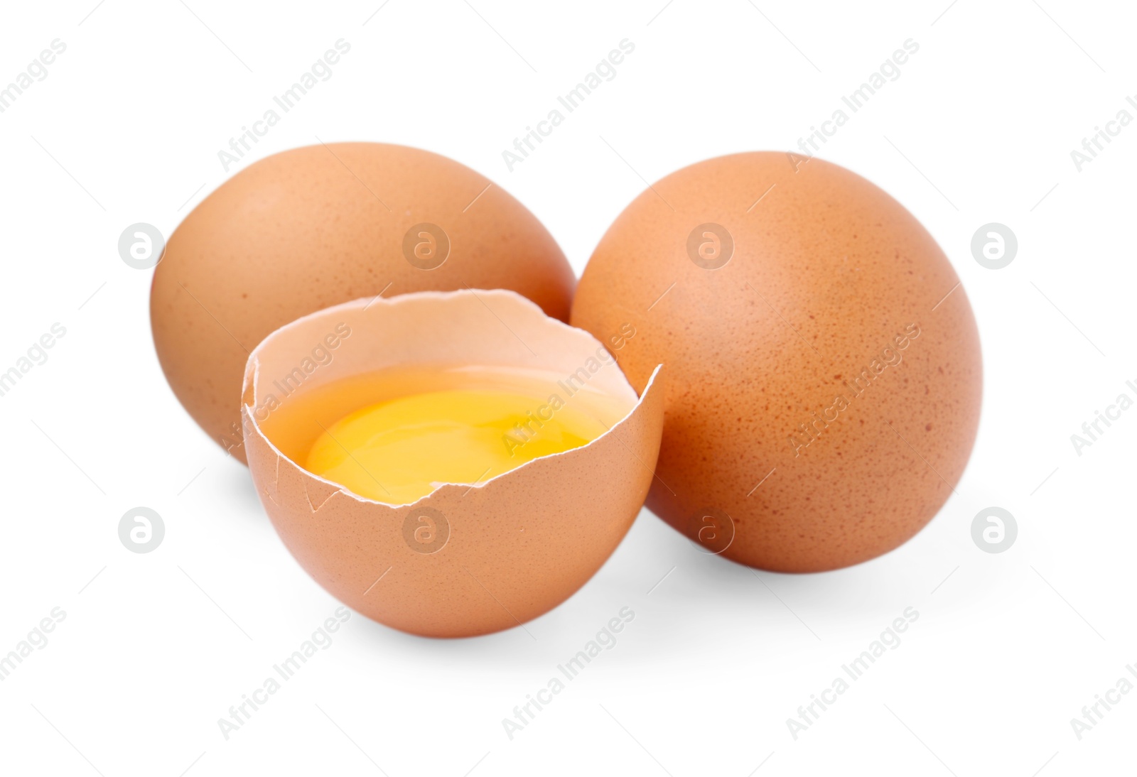 Whole and broken chicken eggs isolated on white Photo of Whole and broken chicken eggs isolated on white