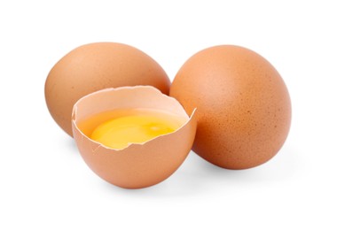 Photo of Whole and broken chicken eggs isolated on white