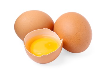 Photo of Whole and broken chicken eggs isolated on white