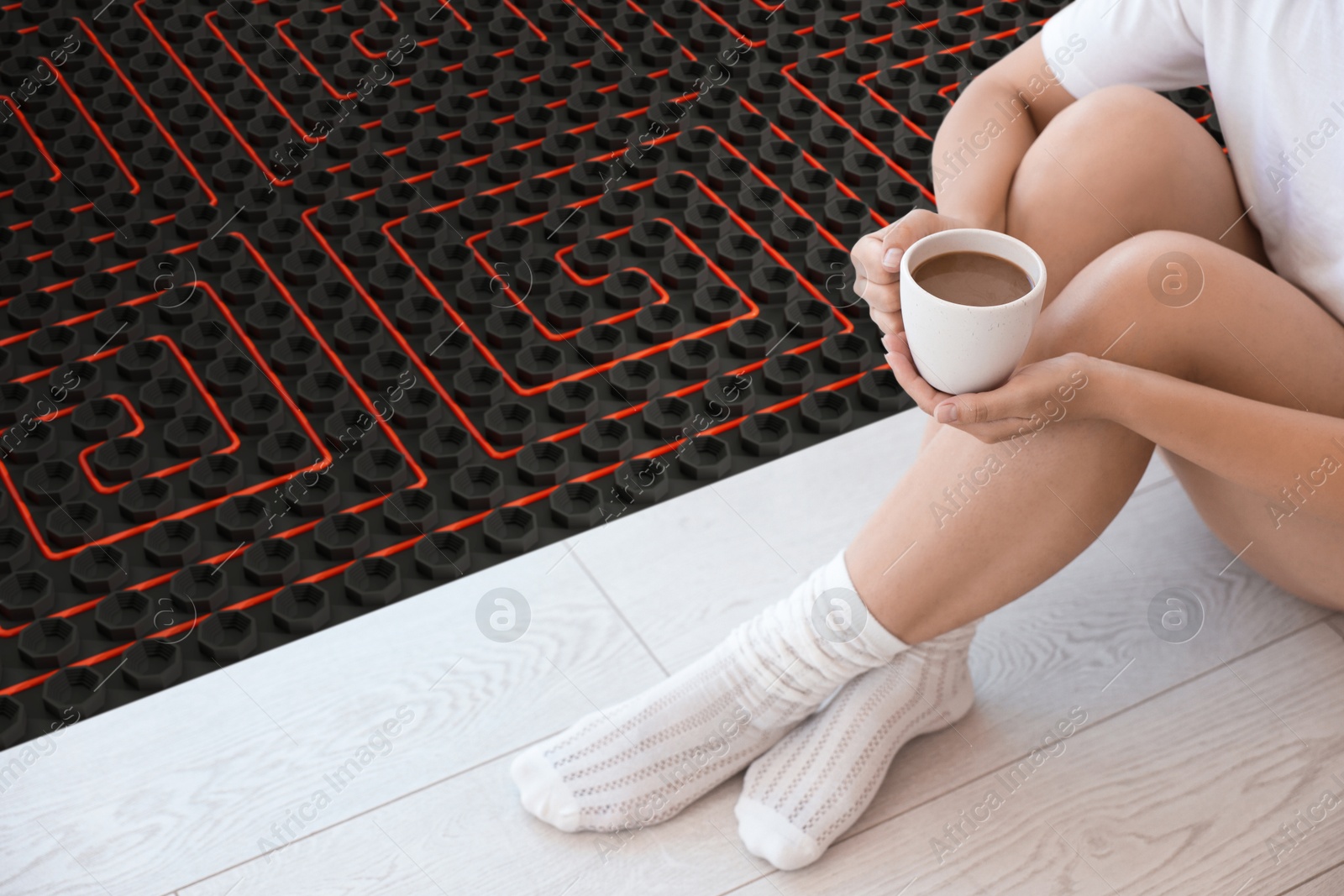Woman with coffee sitting on warm floor indoors, closeup. Underfloor heating system illustration Image of Woman with coffee sitting on warm floor indoors, closeup. Underfloor heating system illustration