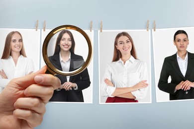 Image of Recruiter looking at candidate's photo through magnifying glass against grey background, closeup. Human resources management