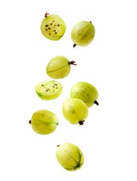 Image of Fresh green gooseberries falling against white background