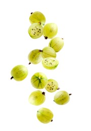 Image of Fresh green gooseberries falling against white background