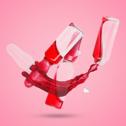 Image of Ampoules and splash of medical or cosmetic liquid in air against pink background