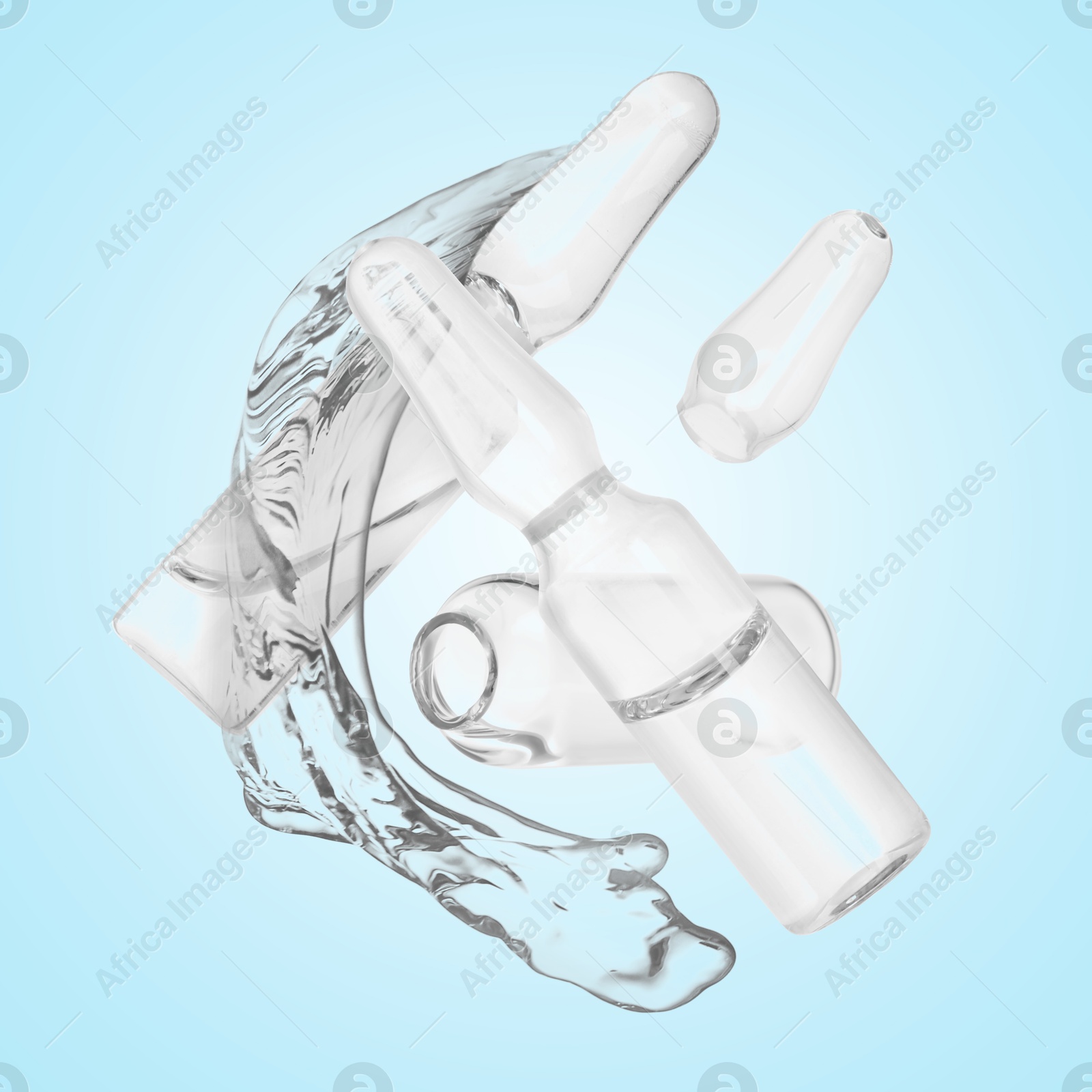 Image of Ampoules and splash of medical or cosmetic liquid in air against light blue background