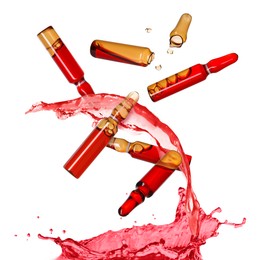 Image of Ampoules and splash of medical or cosmetic liquid in air against white background