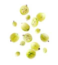 Image of Fresh green gooseberries falling against white background