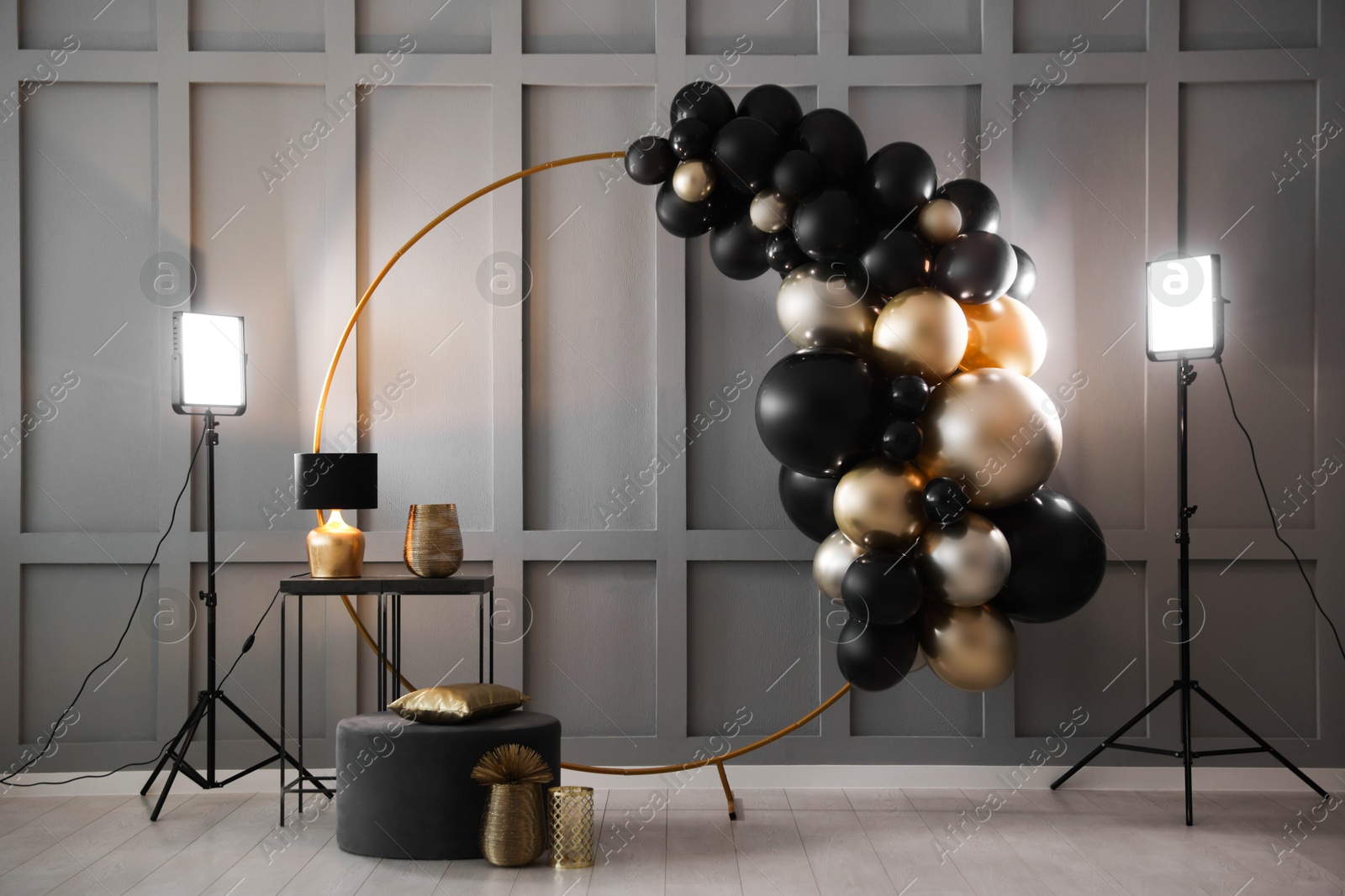 Photo of Stylish photo zone with balloons and decor in studio
