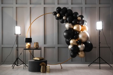 Photo of Stylish photo zone with balloons and decor in studio