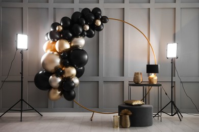 Photo of Stylish photo zone with balloons and decor in studio