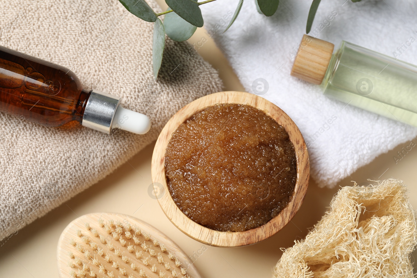 Natural body scrub and ingredients on beige table, flat lay Photo of Natural body scrub and ingredients on beige table, flat lay