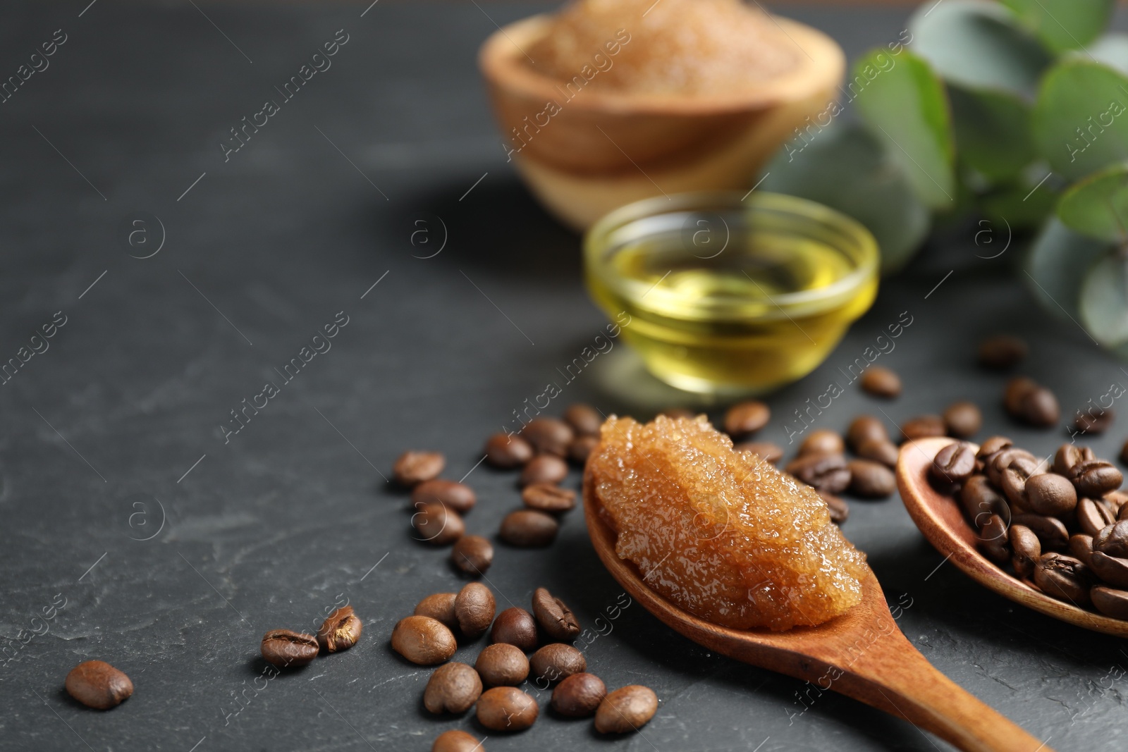 Natural body scrub and ingredients on black table, closeup. Space for text Photo of Natural body scrub and ingredients on black table, closeup. Space for text