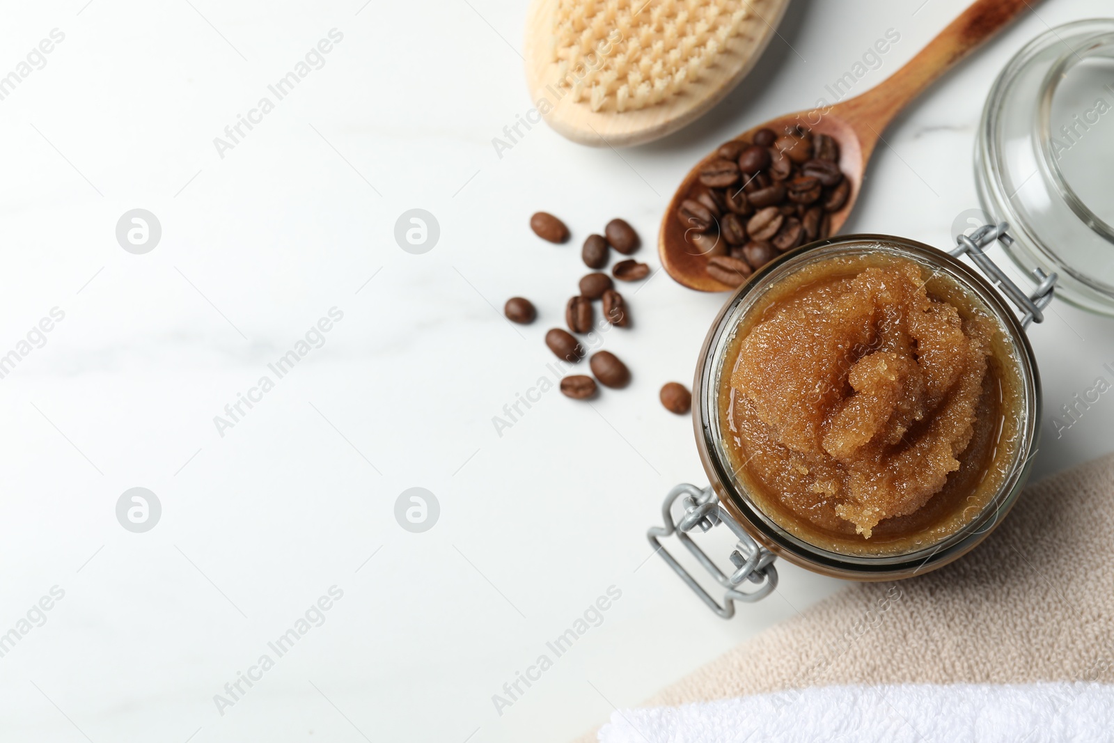 Photo of Natural body scrub and ingredients on white table, flat lay. Space for text