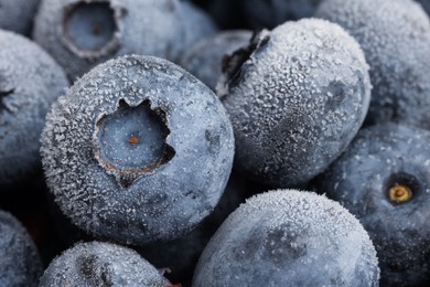 Photo of Many frozen blueberries as background, macro view