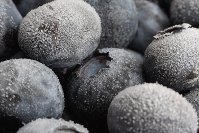 Photo of Many frozen blueberries as background, macro view