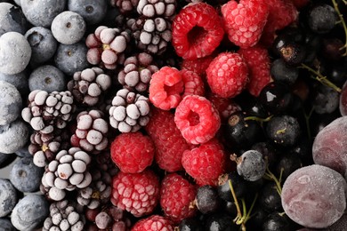 Photo of Many different frozen berries as background, top view