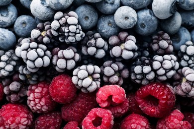 Photo of Many different frozen berries as background, top view