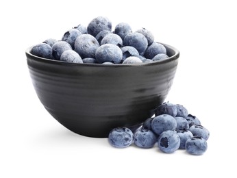 Photo of Many frozen blueberries in bowl isolated on white