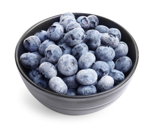 Photo of Many frozen blueberries in bowl isolated on white