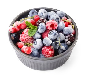 Photo of Many different frozen berries and mint in isolated on white