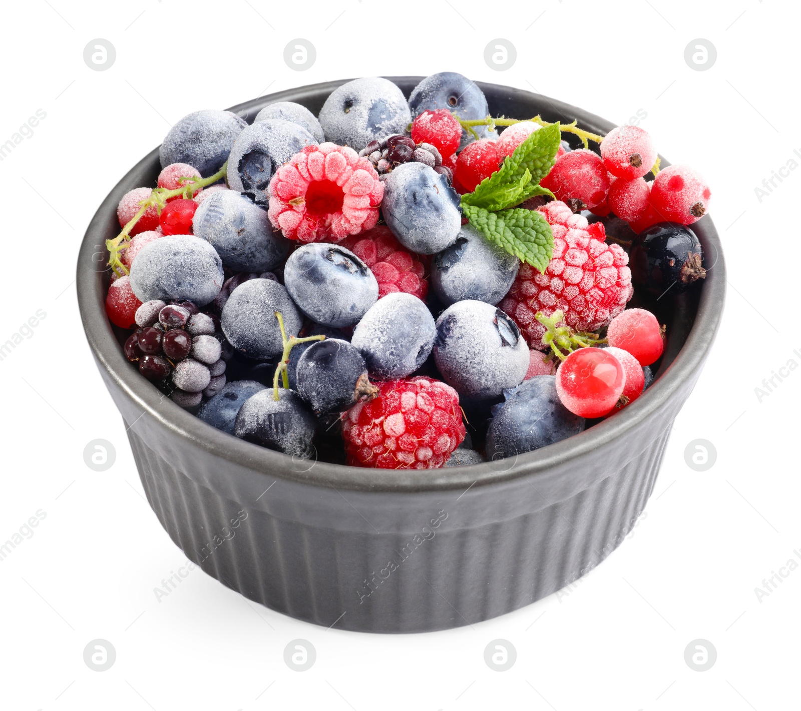 Photo of Many different frozen berries and mint in isolated on white