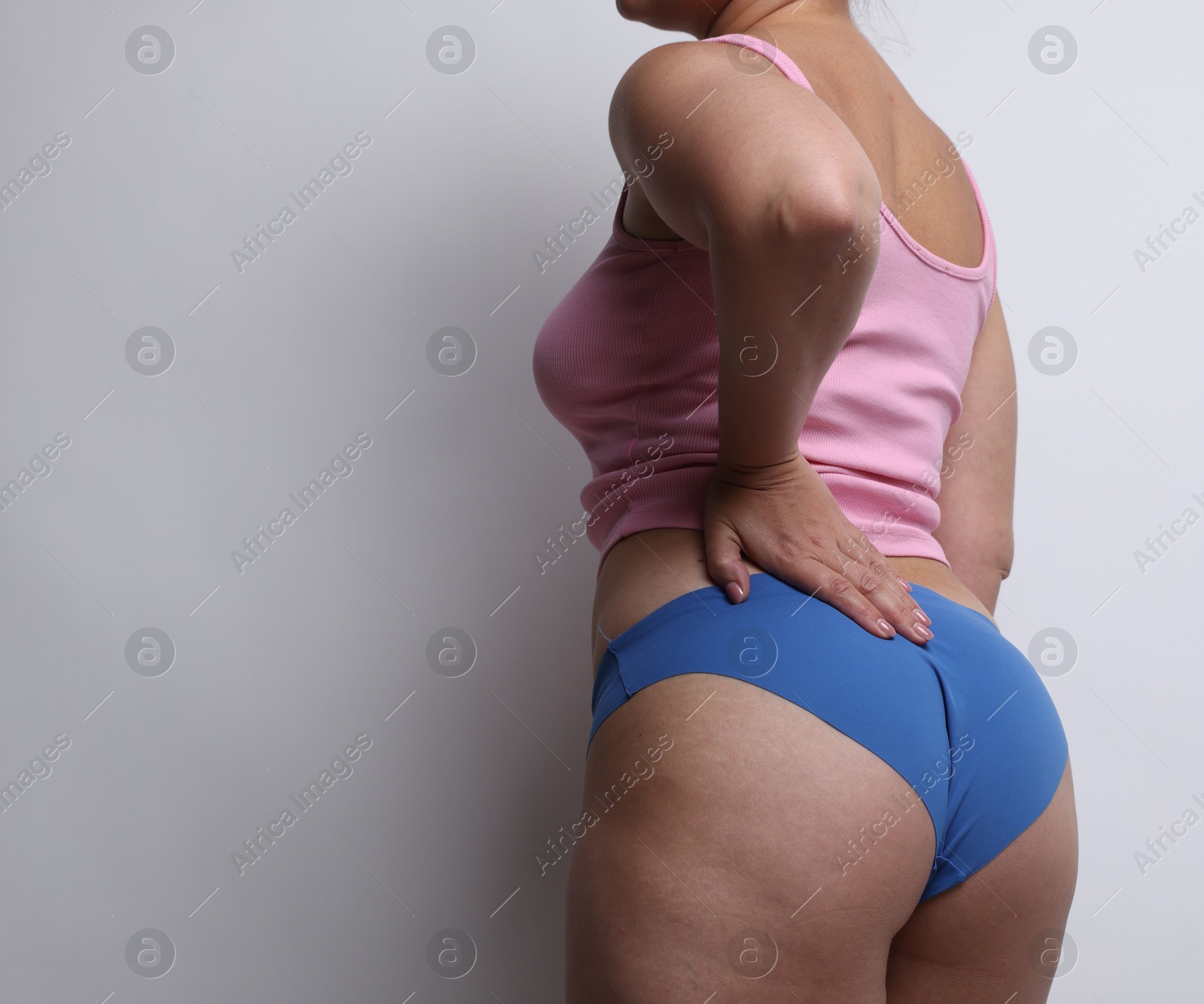 Photo of Liposuction. Woman in underwear on light grey background, closeup. Space for text