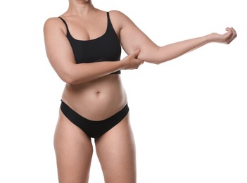 Photo of Liposuction. Woman in underwear touching her arm on white background, closeup