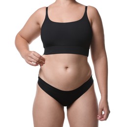 Photo of Liposuction. Woman in underwear touching her belly on white background, closeup