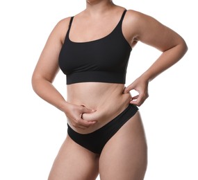 Photo of Liposuction. Woman in underwear touching her belly on white background, closeup