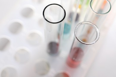 Photo of Solution chemistry. Test tubes with different samples on table, above view. Space for text