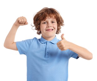 Photo of Strength. Happy little boy showing his biceps and thumbs up on white background