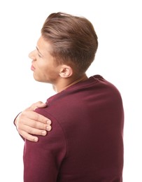 Photo of Young man suffering from shoulder pain on white background