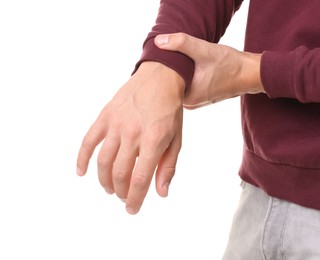 Photo of Man suffering from wrist pain on white background, closeup