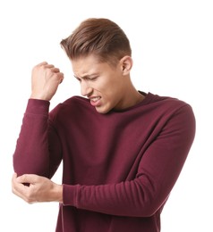Photo of Young man suffering from elbow pain on white background