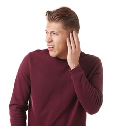 Photo of Young man suffering from earache on white background