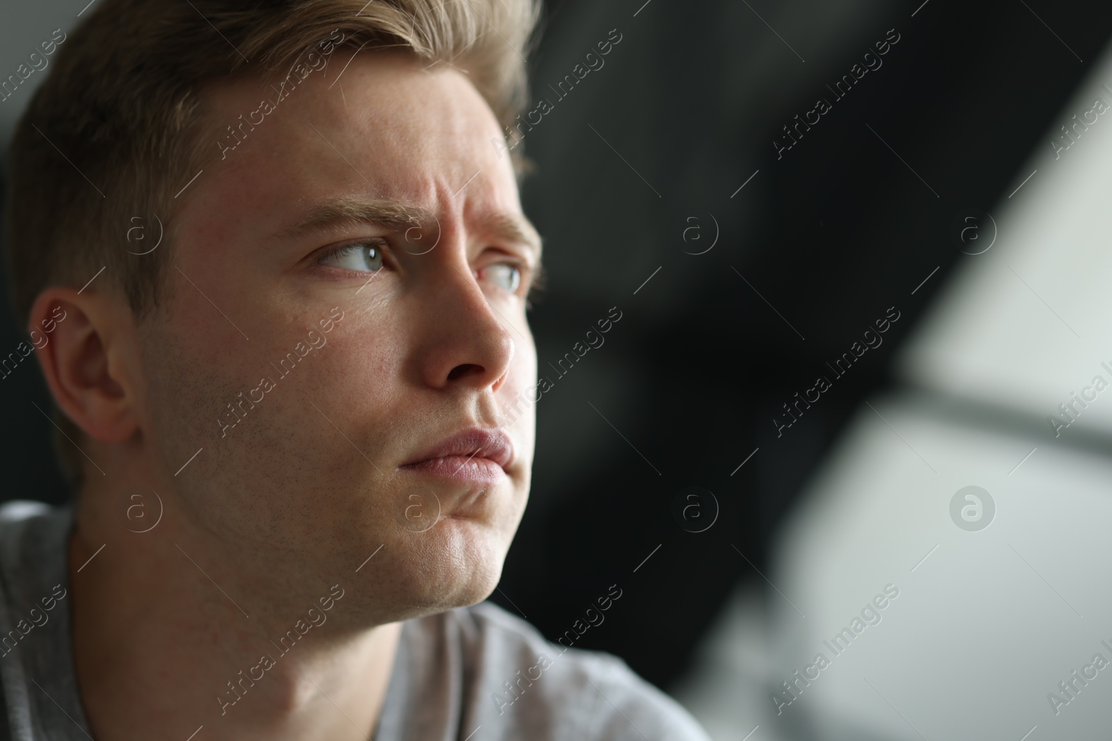Sad man on blurred background, space for text. Depression Photo of Sad man on blurred background, space for text. Depression