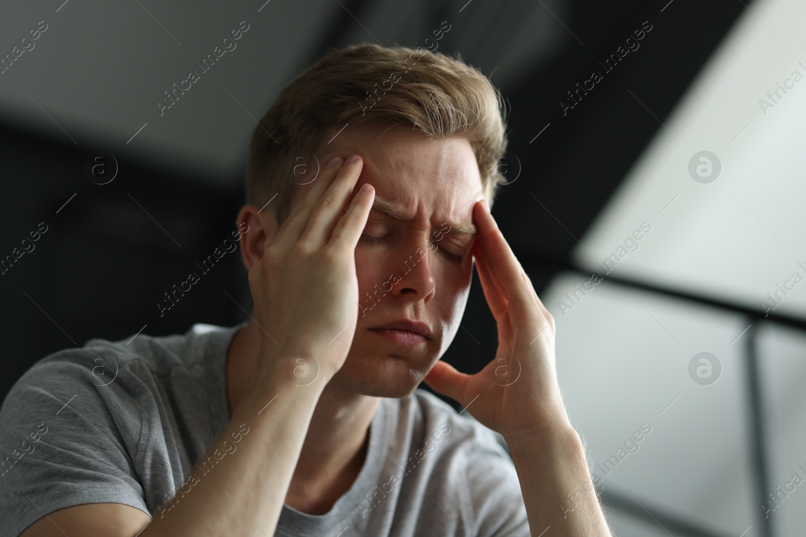 Sad man suffering on blurred background. Depression Photo of Sad man suffering on blurred background. Depression