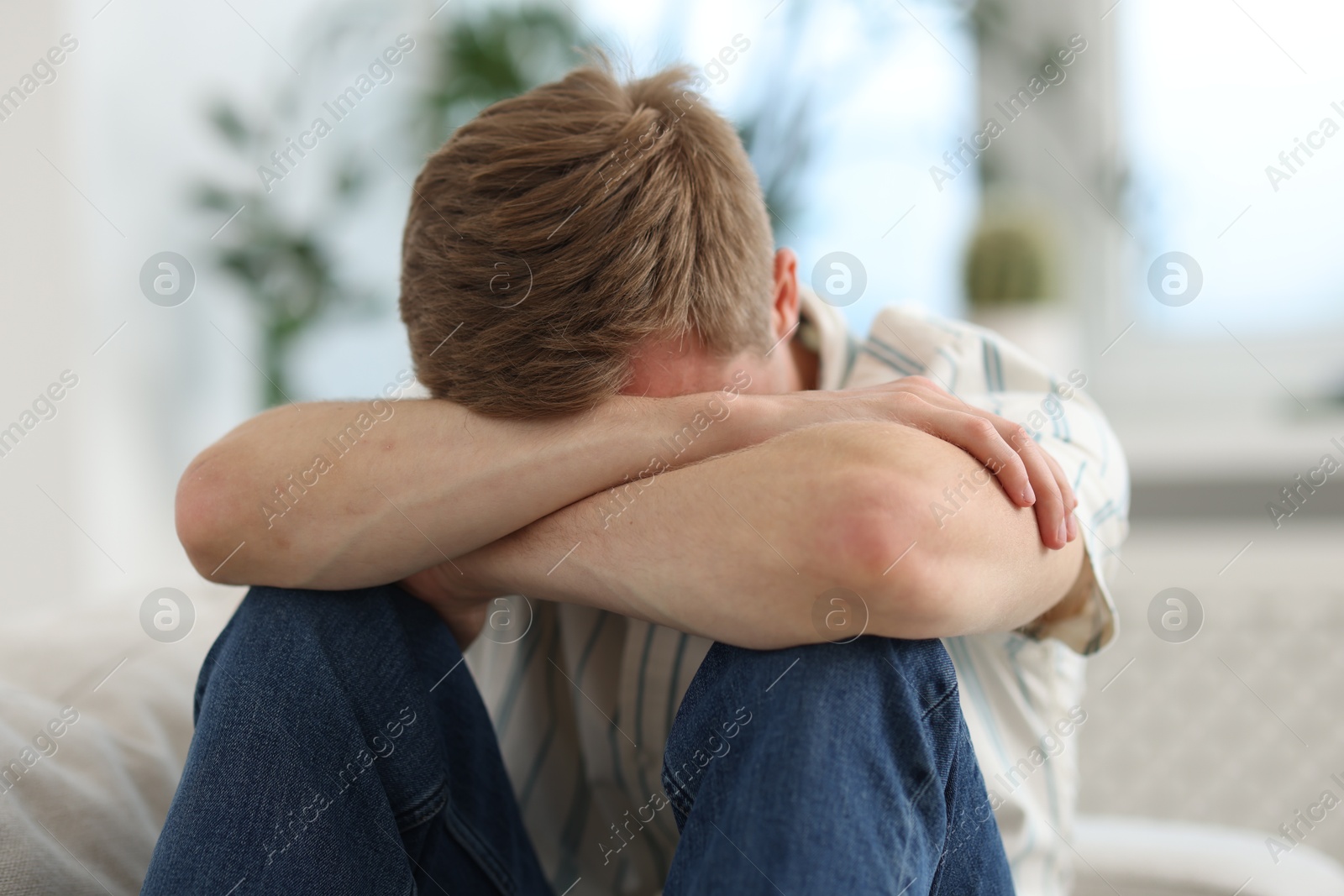 Sad man at home. Depression and anxiety Photo of Sad man at home. Depression and anxiety